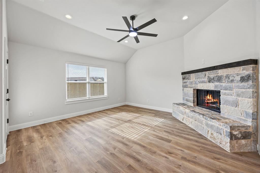 102 Maverick Trail Valley View, TX 76272 - Photo 8 of 32 an empty room with windows and fireplace