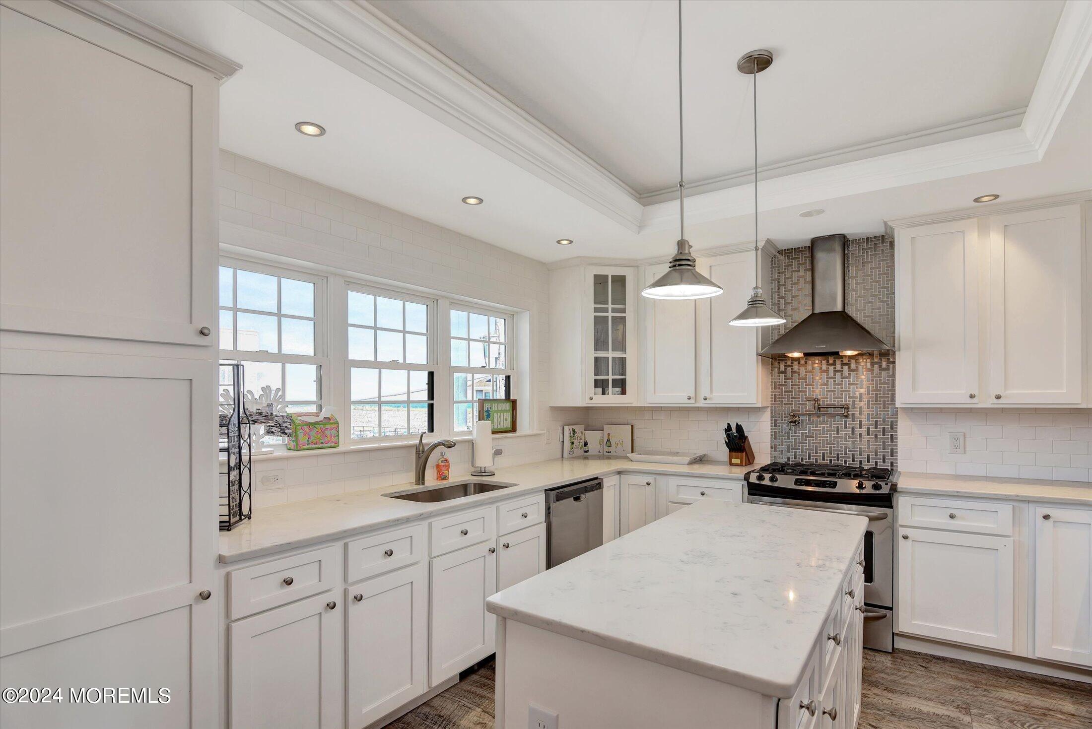 5 Fielder Avenue Seaside Heights, NJ 08751 - Photo 24 of 55 a kitchen with stainless steel appliances granite countertop a sink a stove and a refrigerator