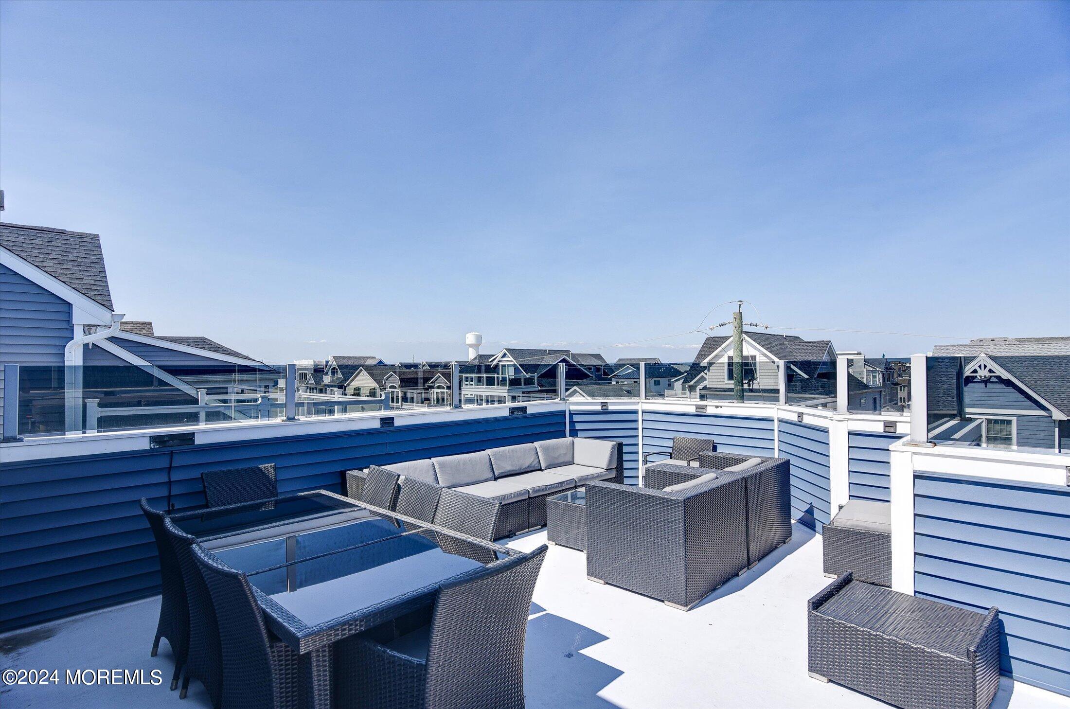 5 Fielder Avenue Seaside Heights, NJ 08751 - Photo 38 of 55 a view of a roof deck with couches and sky view