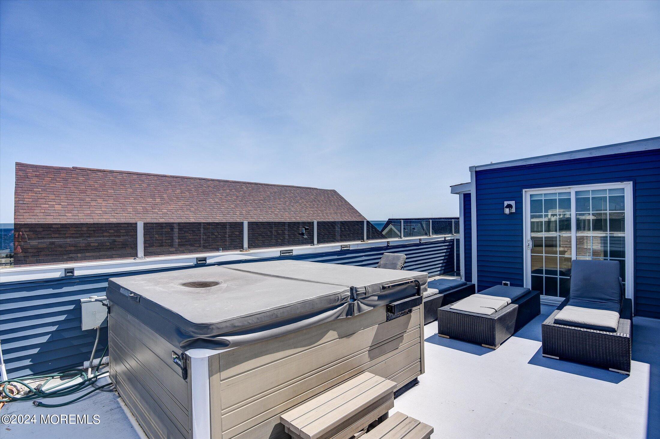 5 Fielder Avenue Seaside Heights, NJ 08751 - Photo 41 of 55 a view of a patio with table and chairs with wooden floor and fence