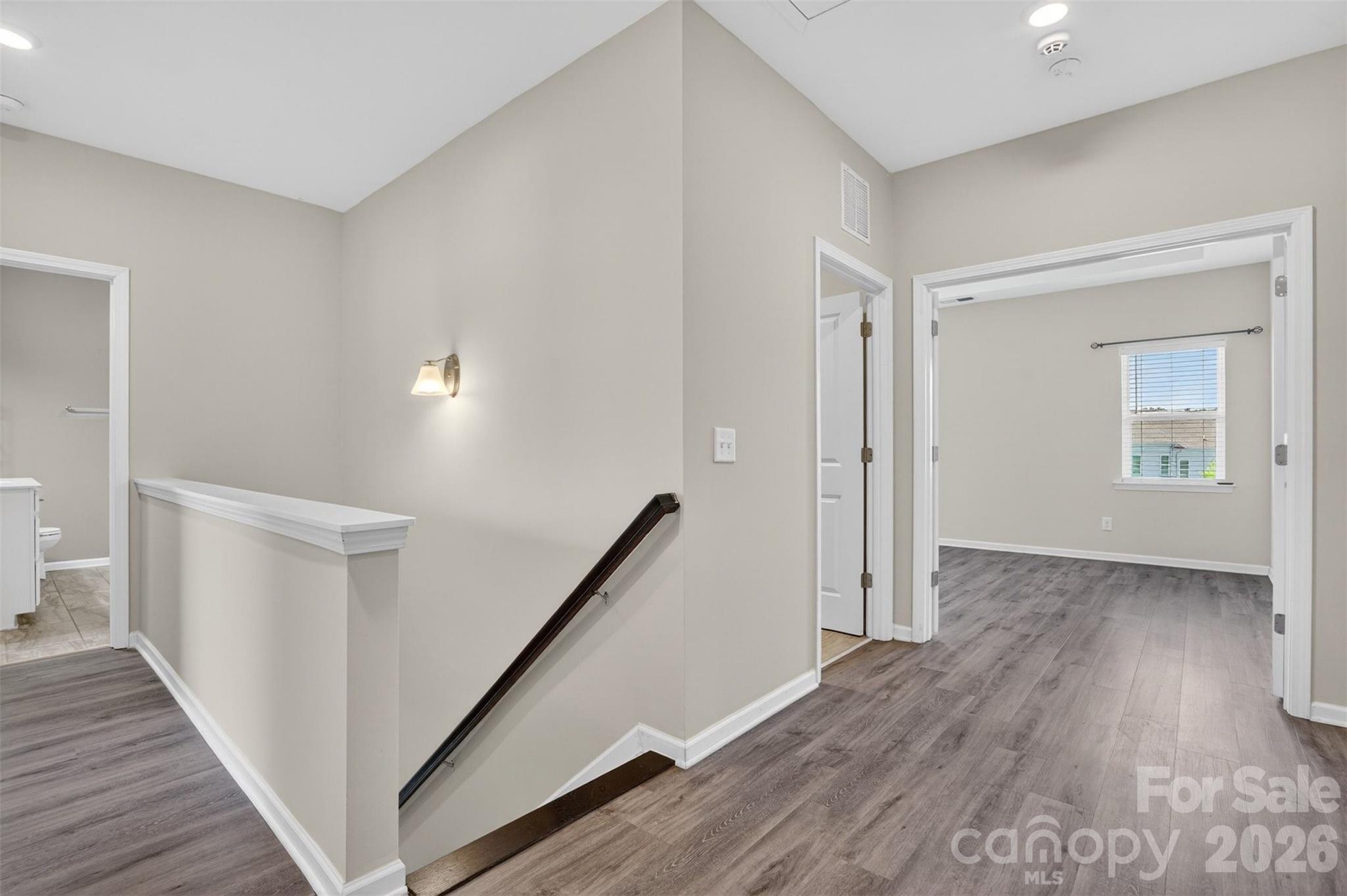 764 River Park Road Belmont, NC 28012 - Photo 13 of 27 a view of a hallway with wooden floor and stairs