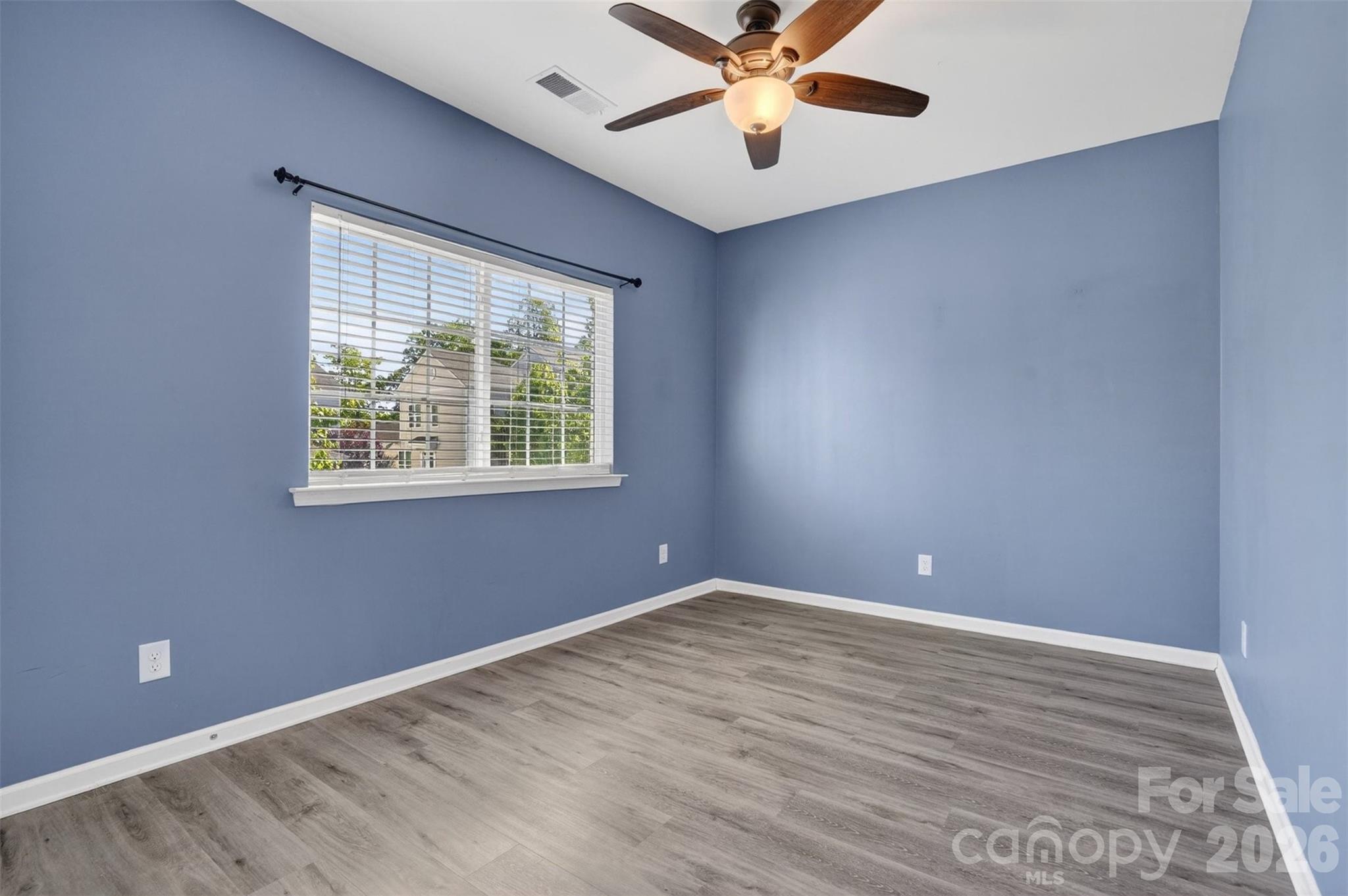 764 River Park Road Belmont, NC 28012 - Photo 17 of 27 an empty room with a window and a fan