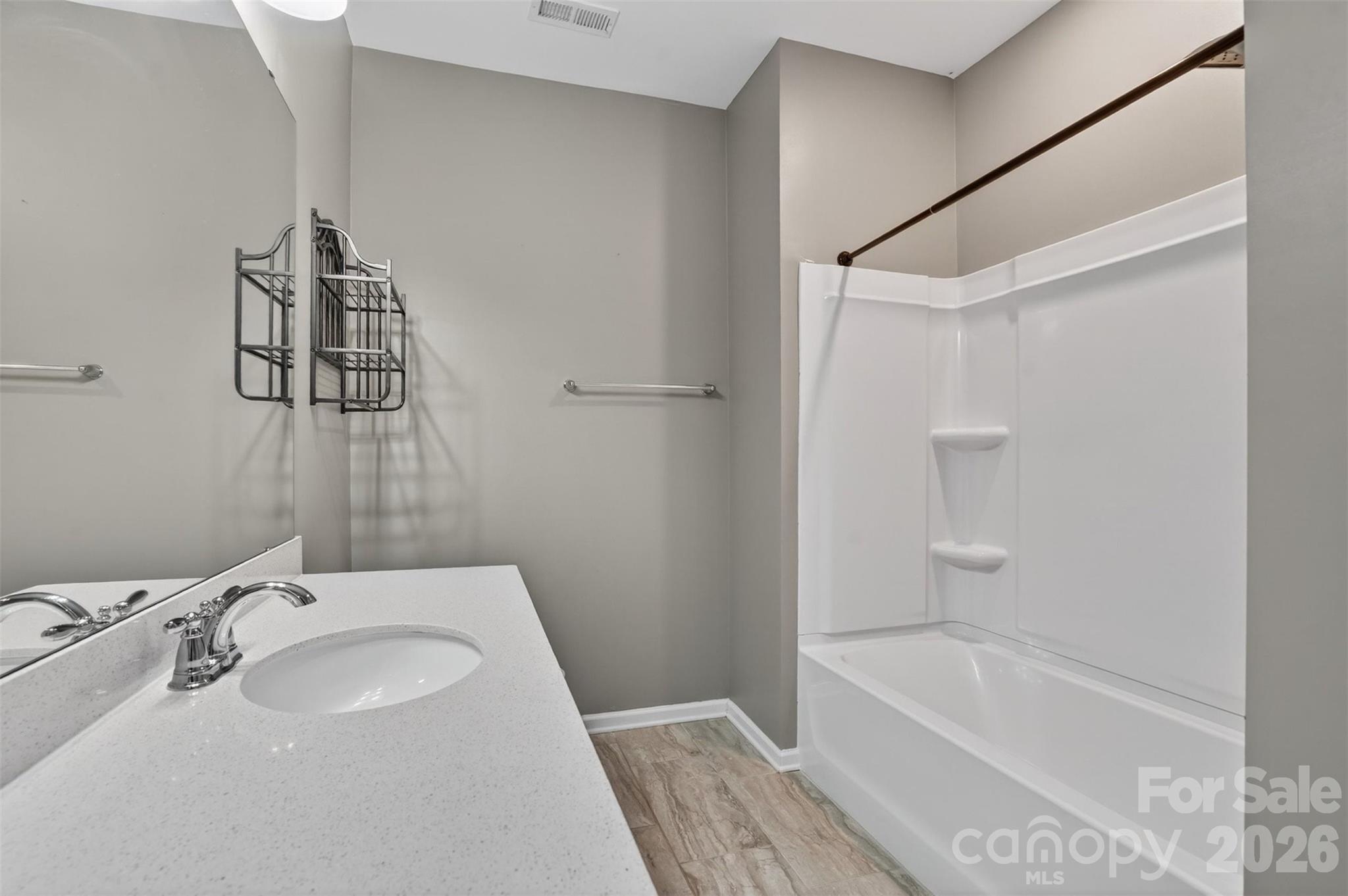 764 River Park Road Belmont, NC 28012 - Photo 19 of 27 a bathroom with a sink and a bathtub