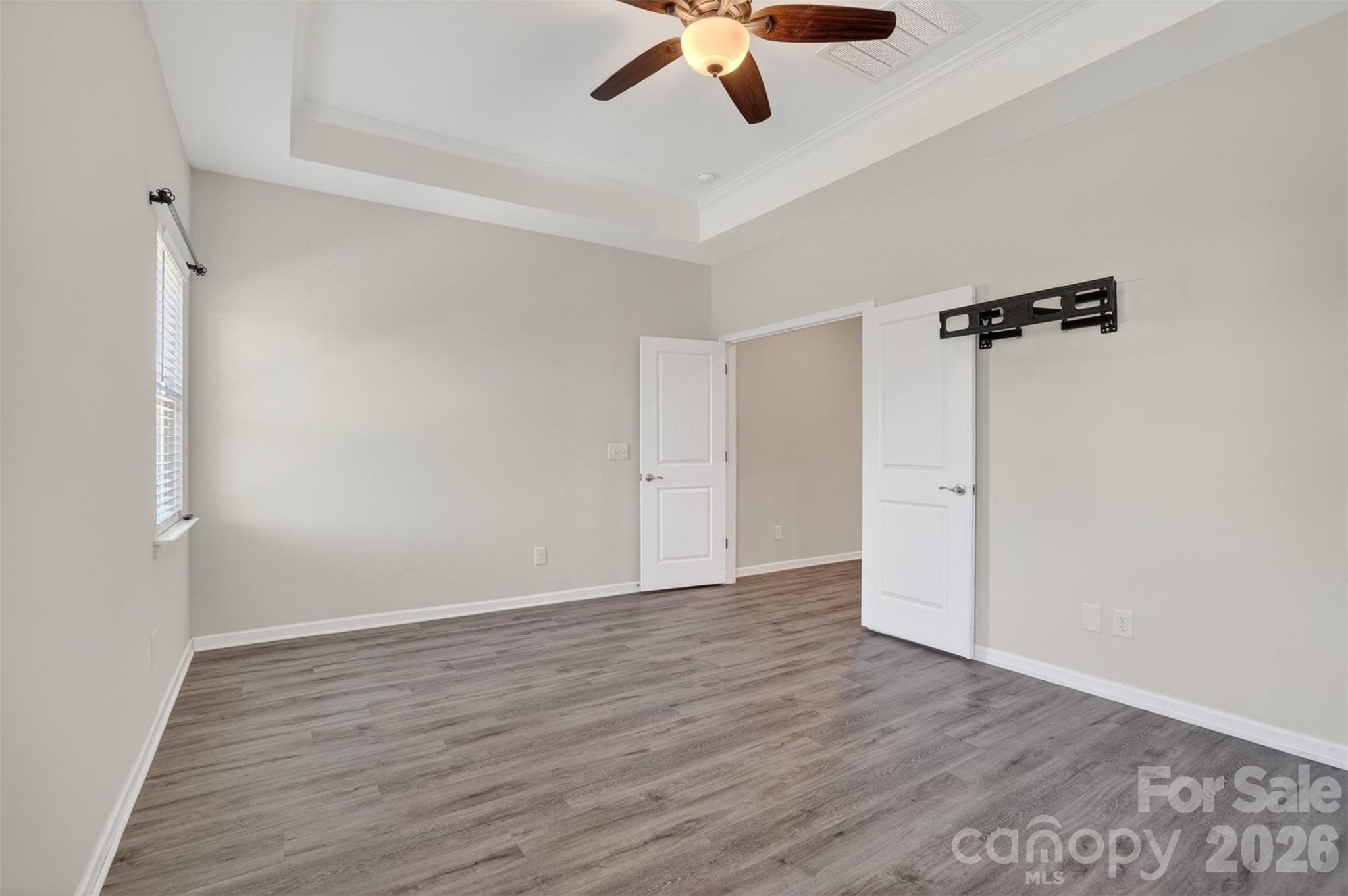 764 River Park Road Belmont, NC 28012 - Photo 20 of 27 an empty room with wooden floor ceiling fan