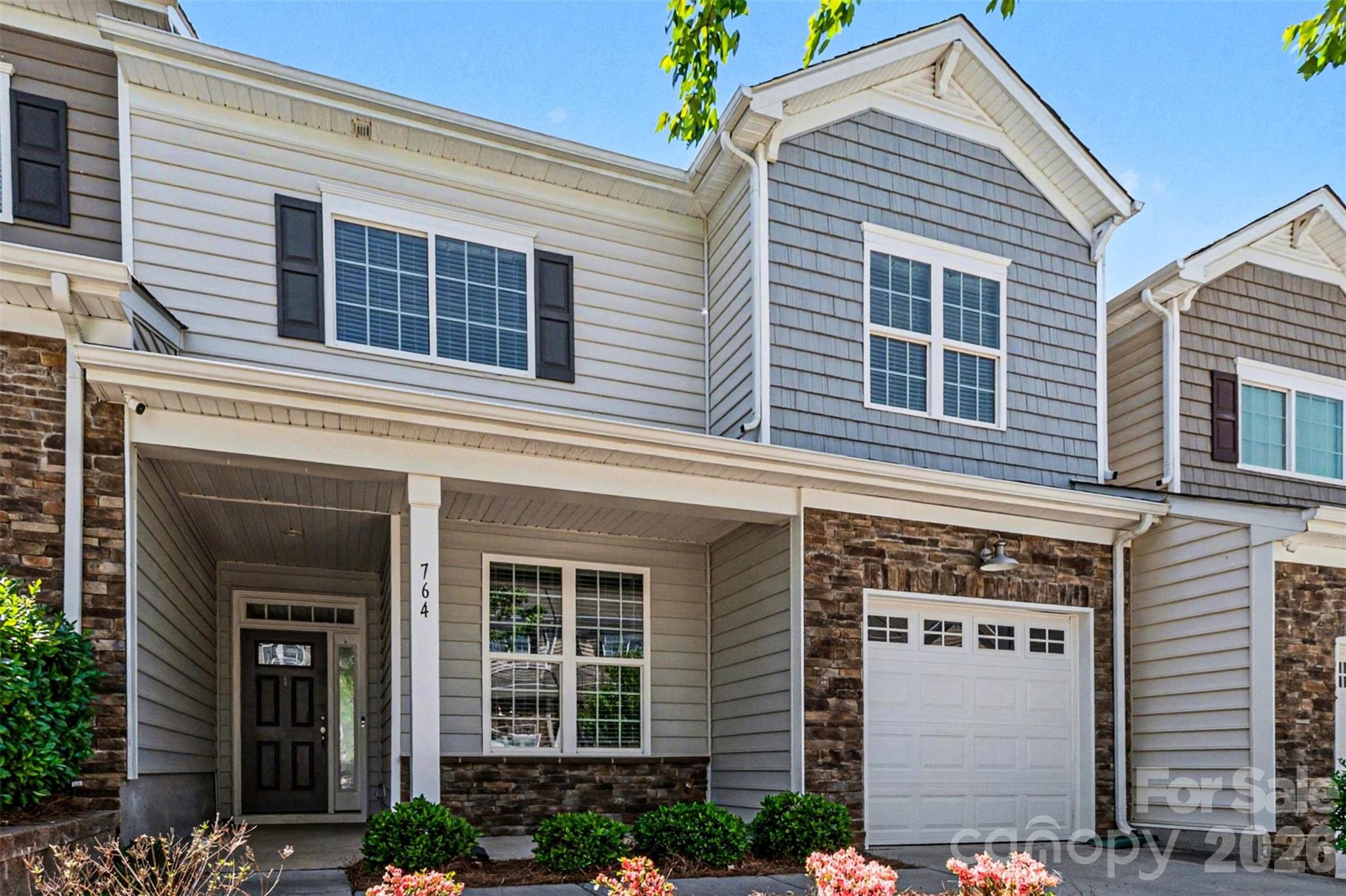 764 River Park Road Belmont, NC 28012 - Photo 2 of 27 a view of a house with large windows and plants