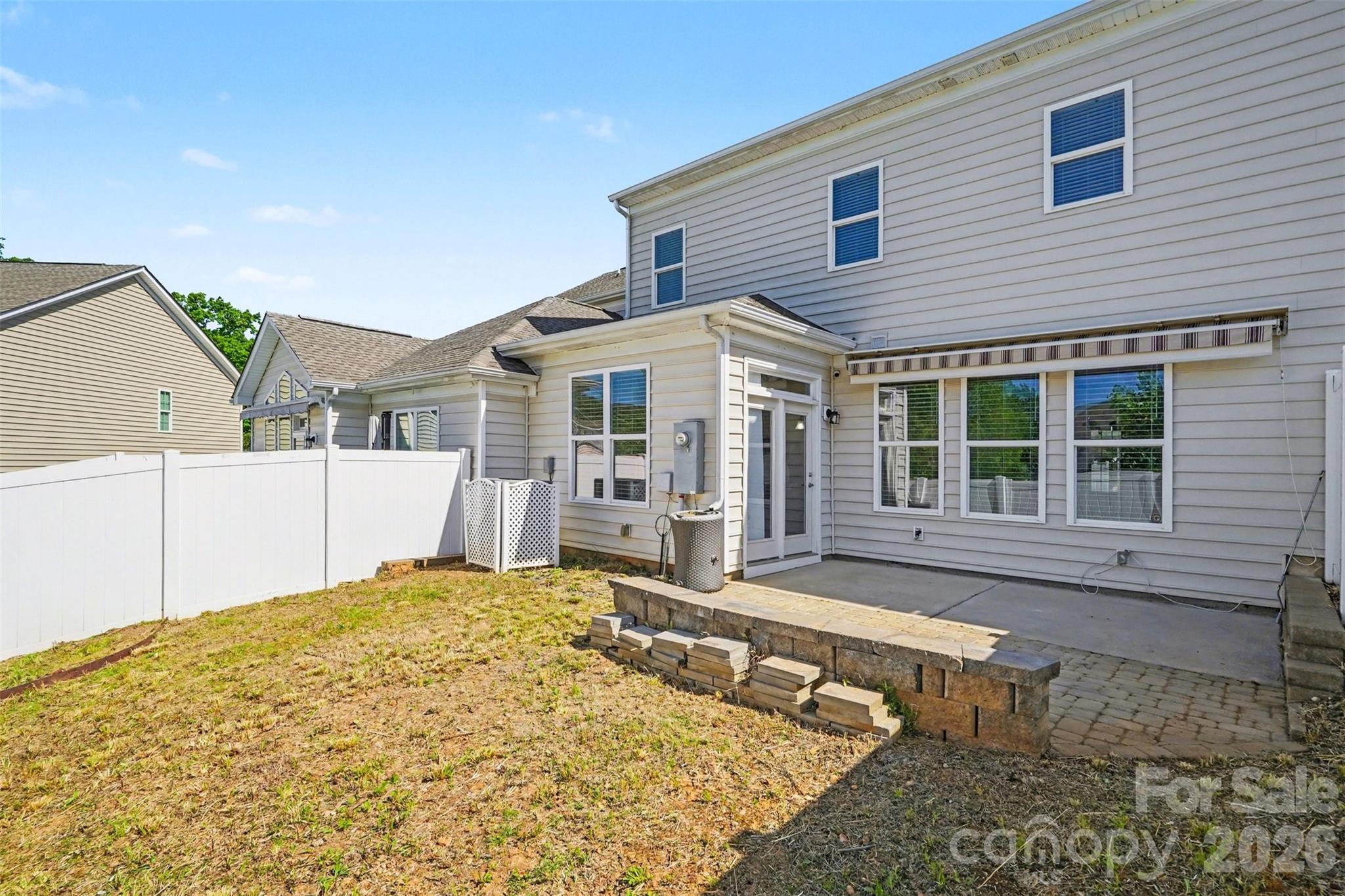 764 River Park Road Belmont, NC 28012 - Photo 26 of 27 a front view of a house with a large window and potted plants
