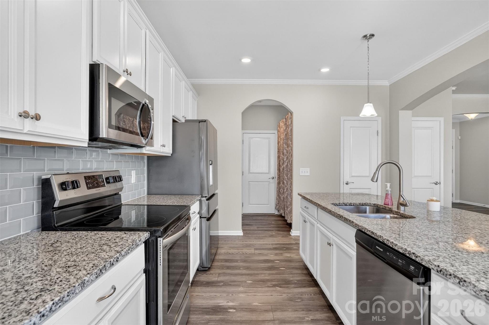764 River Park Road Belmont, NC 28012 - Photo 7 of 27 a kitchen with stainless steel appliances granite countertop a sink stove and refrigerator