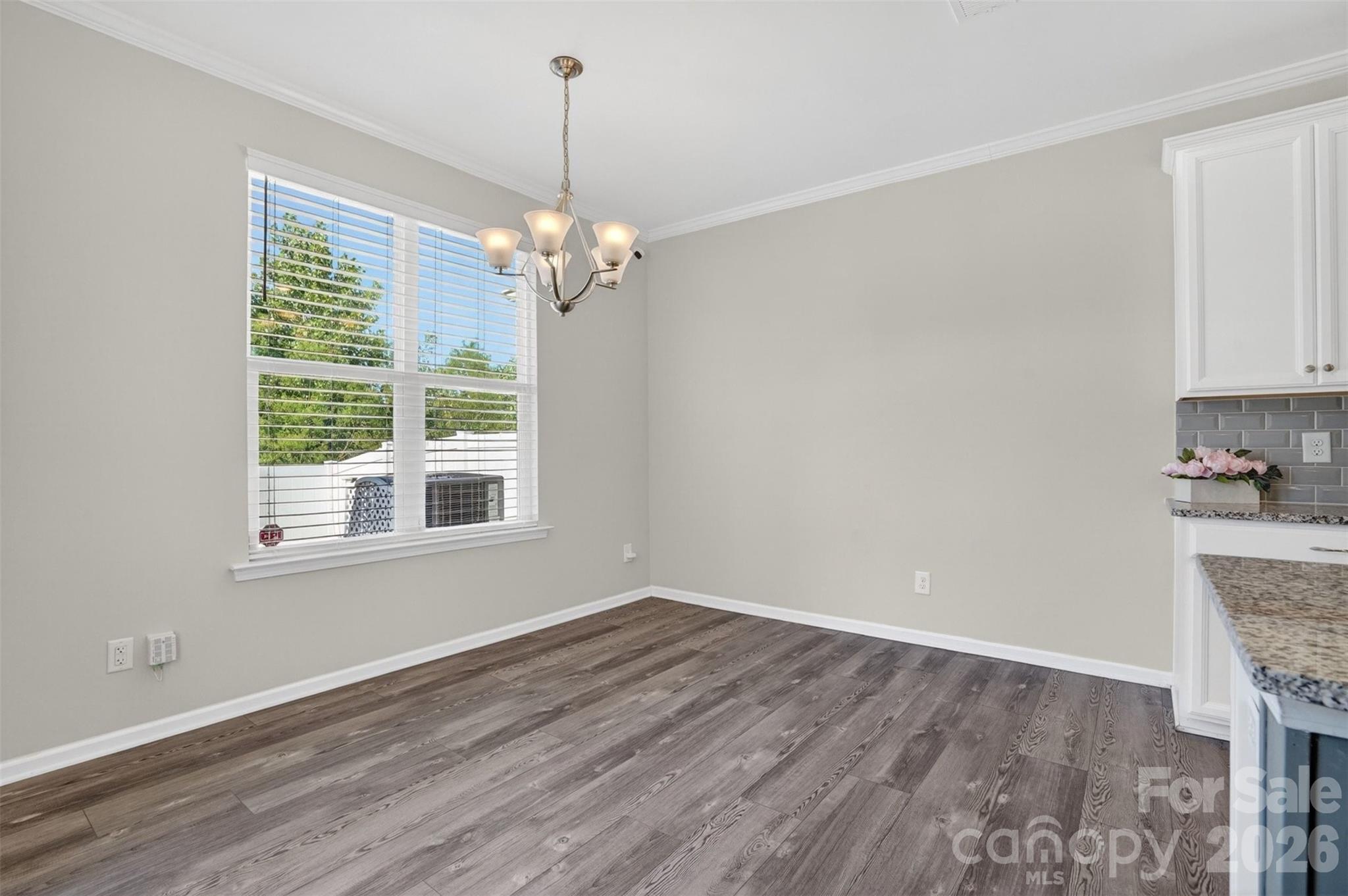764 River Park Road Belmont, NC 28012 - Photo 9 of 27 a view of empty room with wooden floor and window