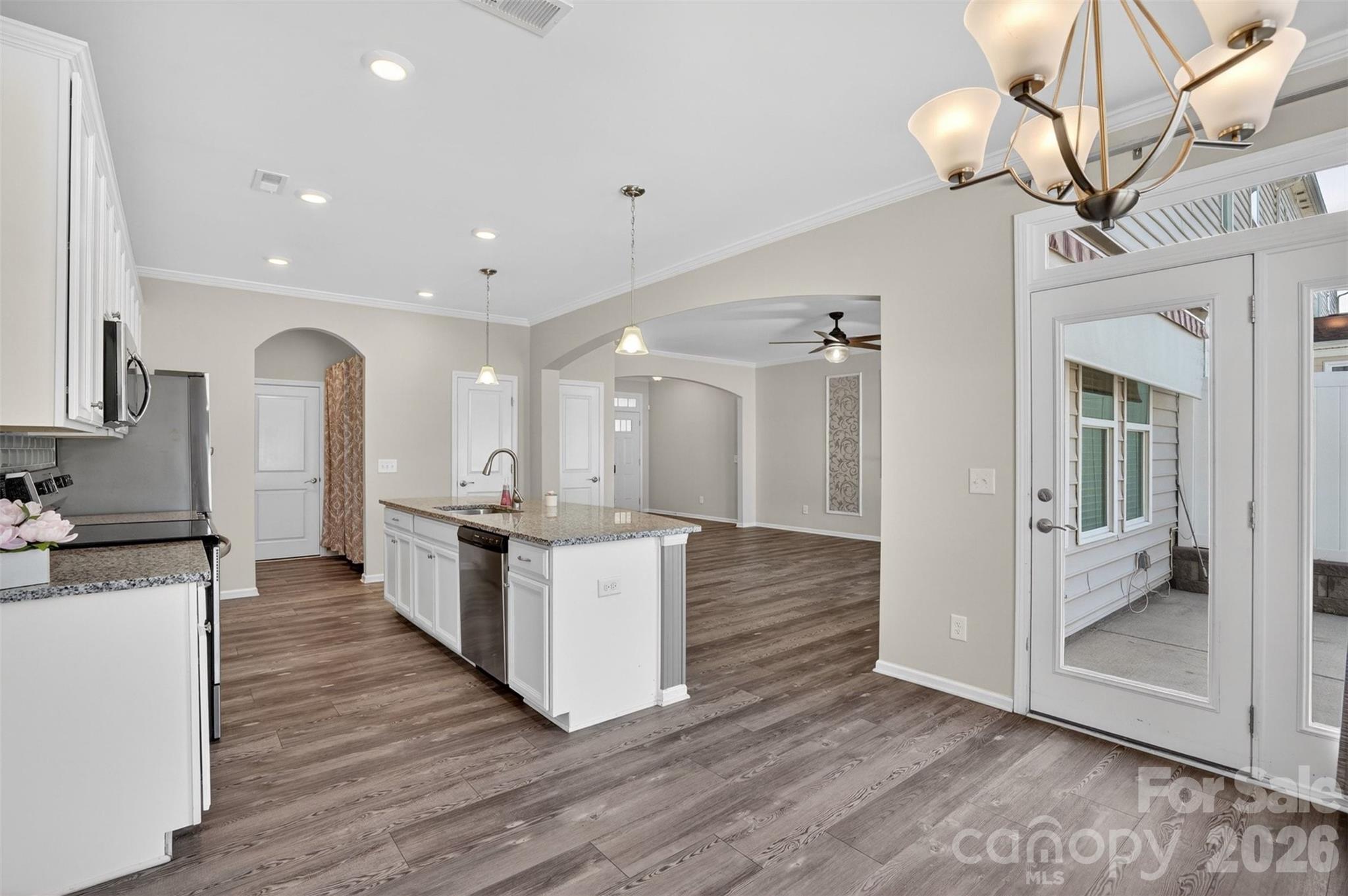 764 River Park Road Belmont, NC 28012 - Photo 10 of 27 a open kitchen with white cabinets and stainless steel appliances