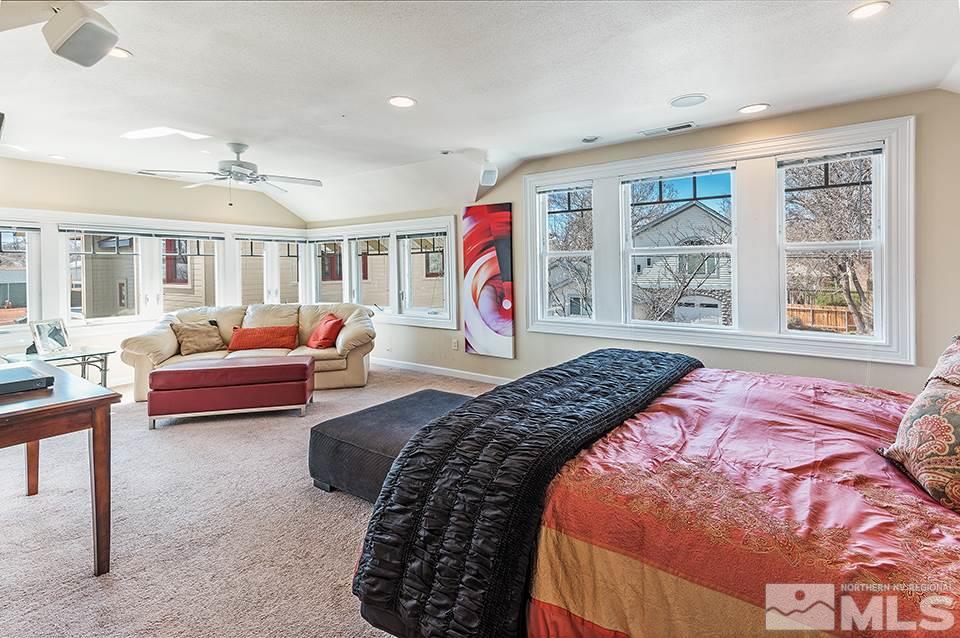 635 South Arlington Avenue Reno, NV 89509 - Photo 18 of 25 a bedroom with furniture and a large window