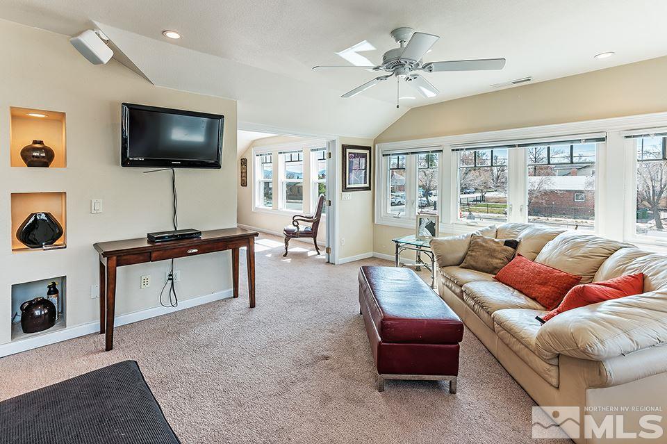 635 South Arlington Avenue Reno, NV 89509 - Photo 19 of 25 a living room with furniture and a flat screen tv