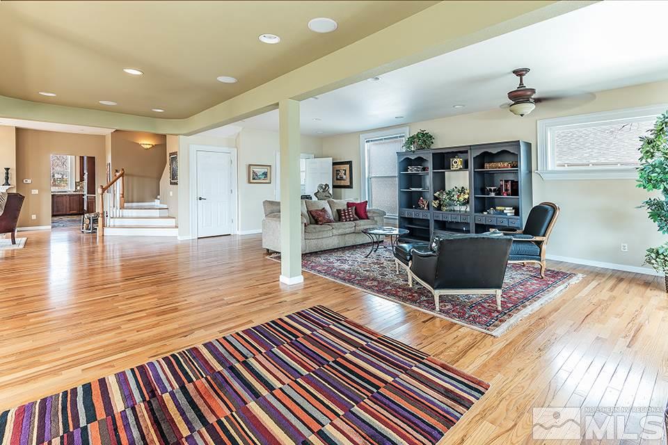 635 South Arlington Avenue Reno, NV 89509 - Photo 3 of 25 a living room with fireplace furniture and a wooden floor