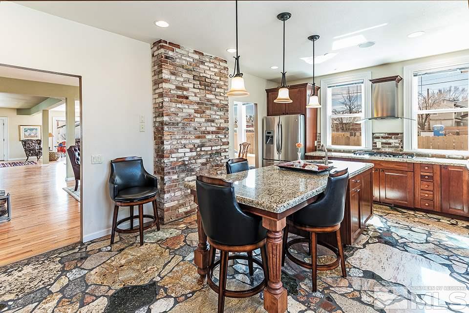 635 South Arlington Avenue Reno, NV 89509 - Photo 9 of 25 a view of a dining room with furniture window and wooden floor