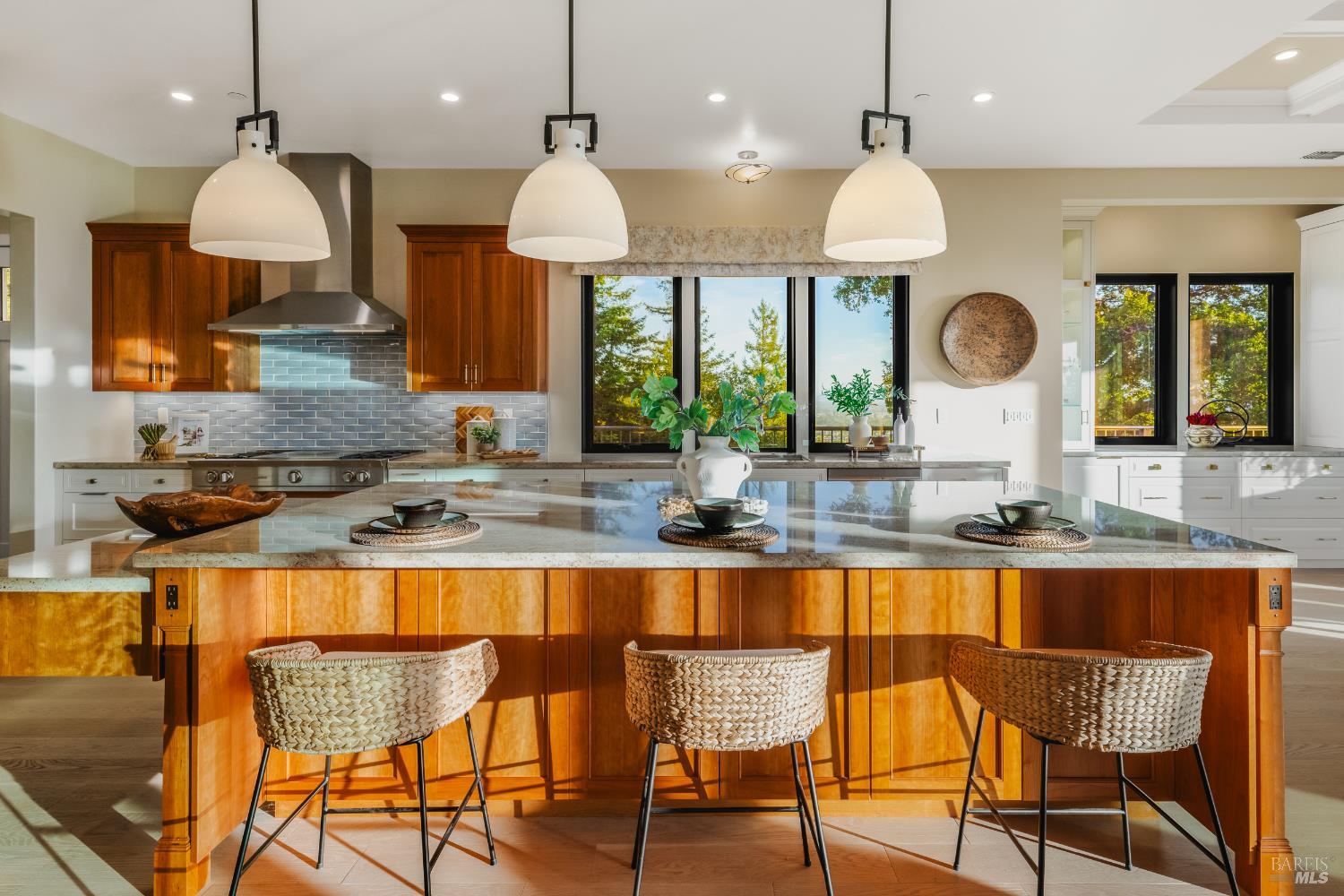 1335 Wikiup Drive Santa Rosa, CA 95403 - Photo 12 of 48 a kitchen with stainless steel appliances granite countertop a stove a sink a oven a dining table and chairs with wooden floor