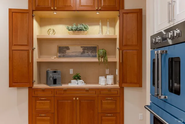a kitchen with a sink and wooden cabinets