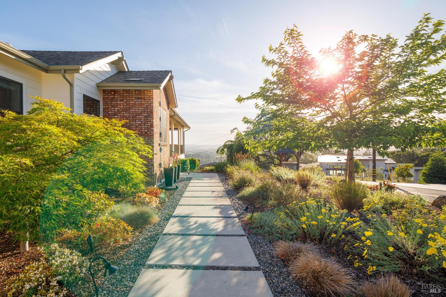 1335 Wikiup Drive Santa Rosa, CA 95403 - Photo 3 of 48 a front view of a house with a yard and fountain in middle