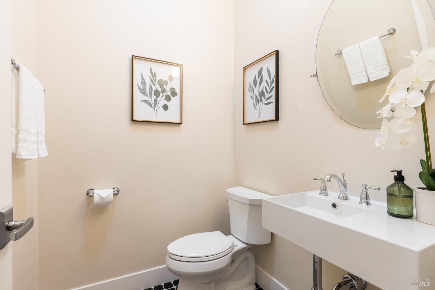 1335 Wikiup Drive Santa Rosa, CA 95403 - Photo 35 of 48 a bathroom with a toilet a sink and mirror