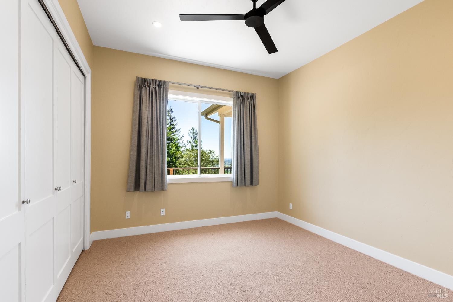 1335 Wikiup Drive Santa Rosa, CA 95403 - Photo 36 of 48 a view of a livingroom with a window and a ceiling fan