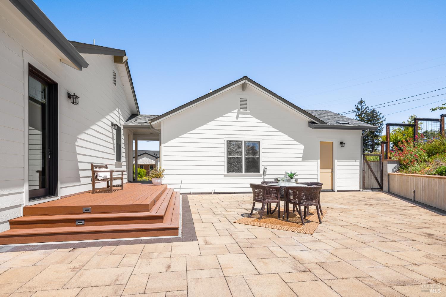 1335 Wikiup Drive Santa Rosa, CA 95403 - Photo 42 of 48 a view of a patio with dining table and chairs with wooden floor