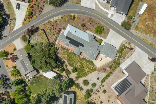 an aerial view of a house with a garden