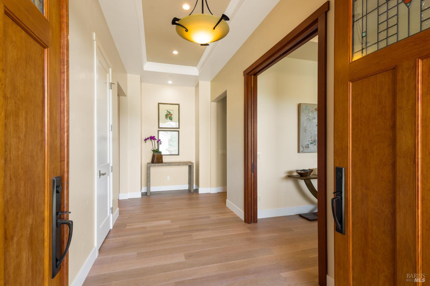 1335 Wikiup Drive Santa Rosa, CA 95403 - Photo 7 of 48 a view of a hallway with wooden floor and a living room