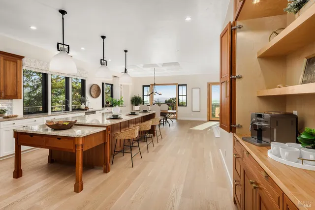 a large kitchen with lots of counter space and a sink