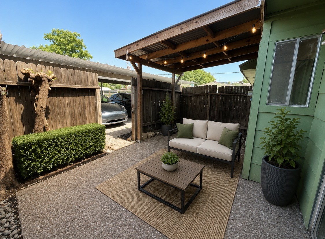 7789 Cook Road Houston, TX 77072 - Photo 5 of 18 a patio view with patio couches a fireplace with wooden floor