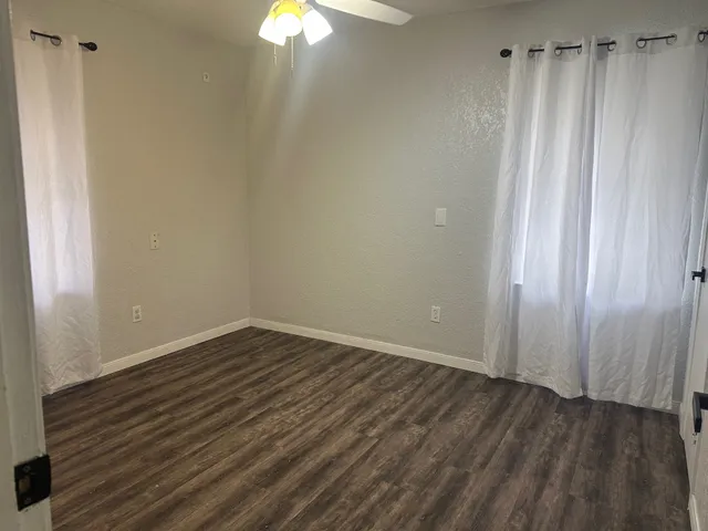 a view of a small space with wooden floor