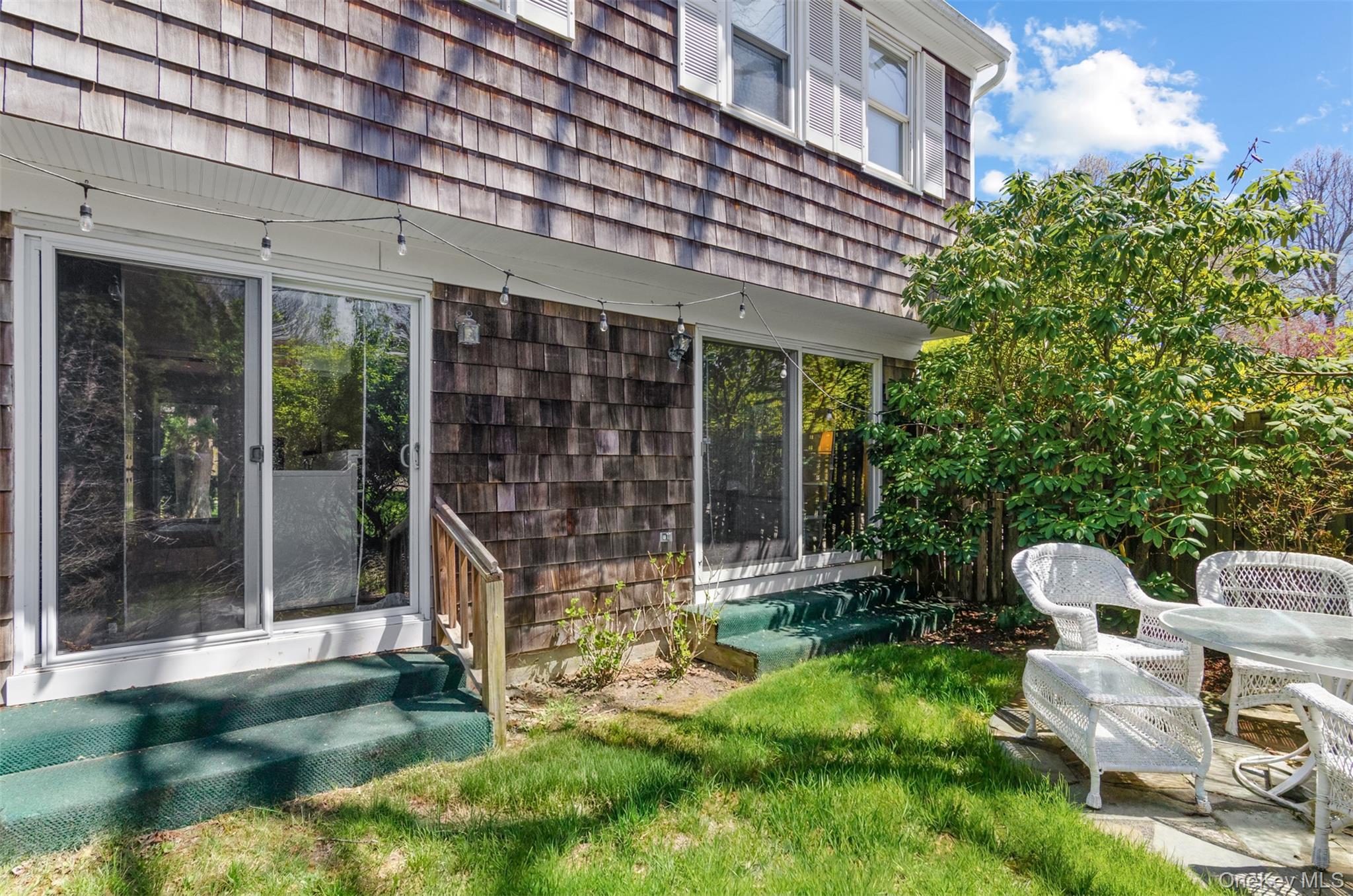 570 Hampton Road, Unit 31 Southampton, NY 11968 - Photo 18 of 20 Sliders to rear yard