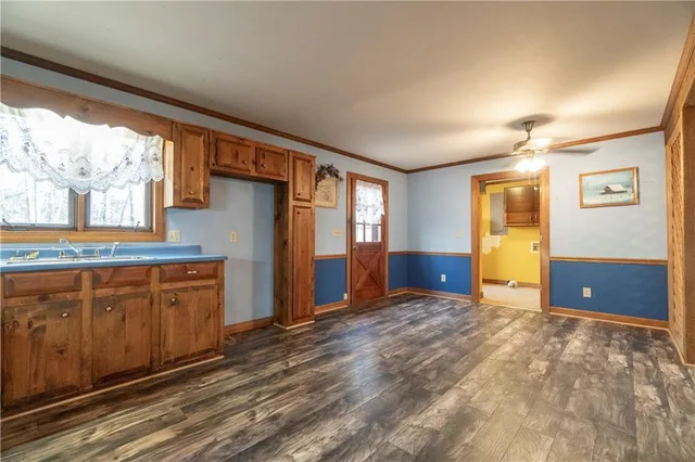 a view of an empty room with stairs