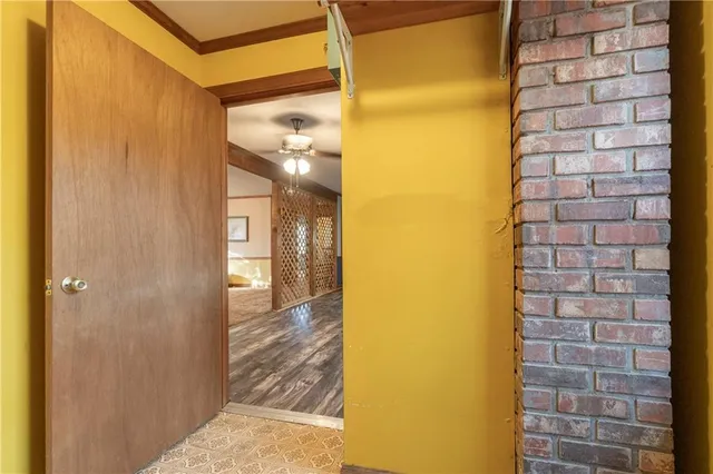 a view of a balcony with chairs and wooden floor