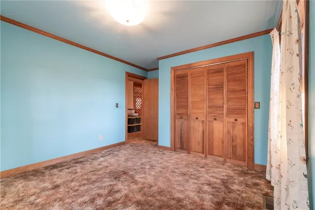 a view of a balcony with wooden floor and stairs