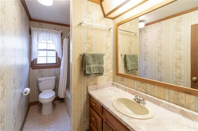 a backyard of a house with a yard and outdoor seating