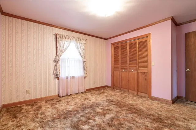a view of a fountain in a yard with potted plants
