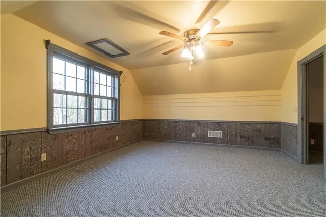 a room with furniture and white walls