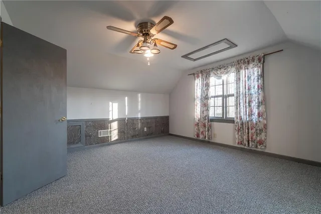 a kitchen with a stove a refrigerator and a dining table