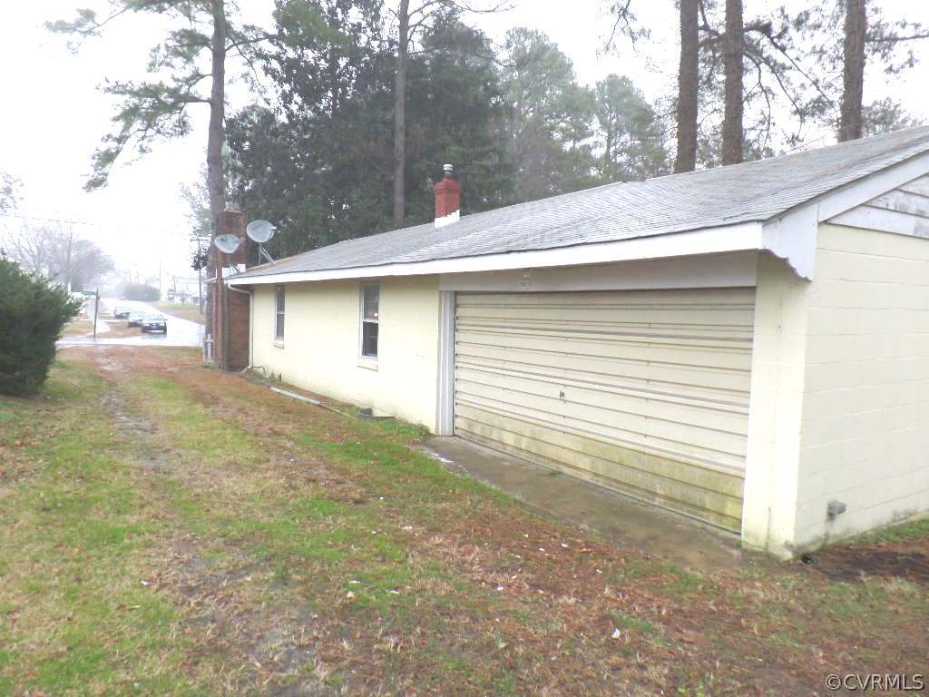 21300 Rutledge Avenue Petersburg, VA 23803 - Photo 2 of 21 a view of a house with a yard and garage