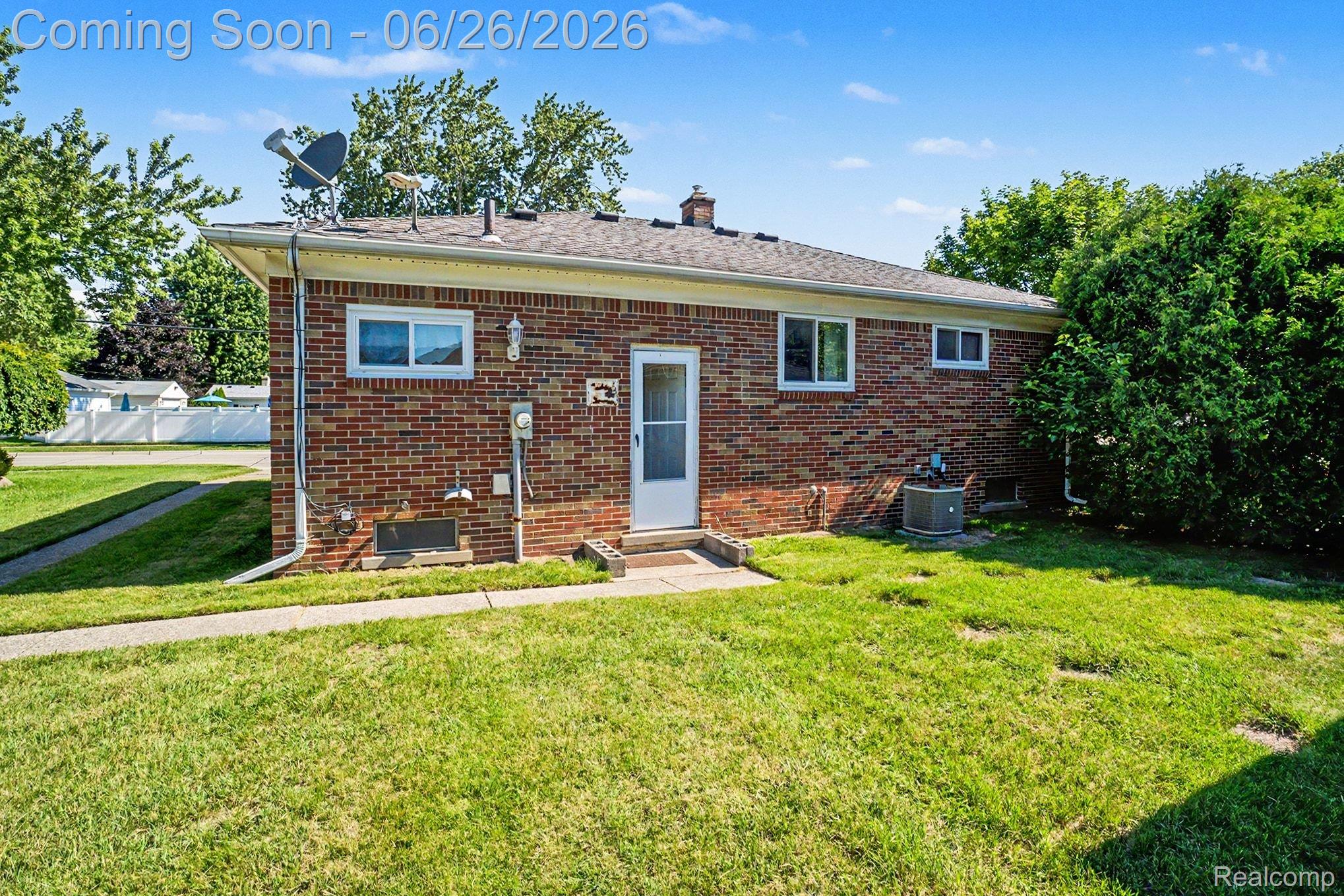 1209 Massoit Road Clawson, MI 48017 - Photo 7 of 25 Brick exterior featuring a gabled roof and white-framed windows