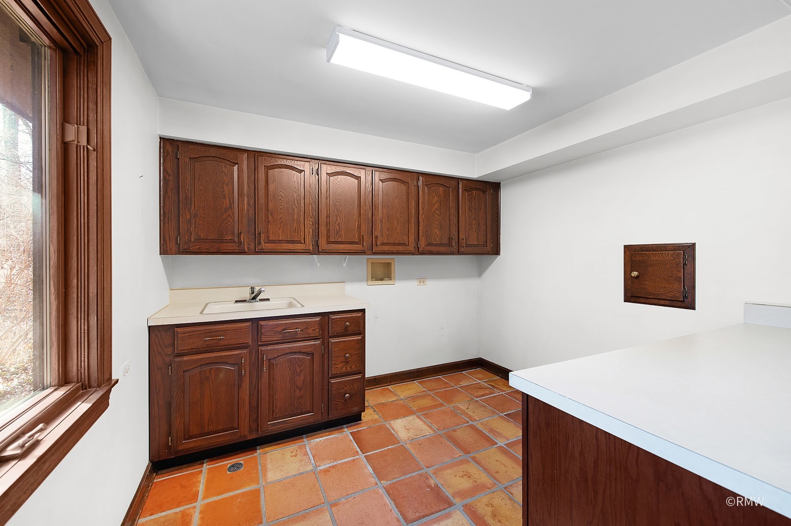 27W161 Mack Road Wheaton, IL 60189 - Photo 30 of 39 a kitchen with stainless steel appliances a stove a sink and a refrigerator with wooden cabinets