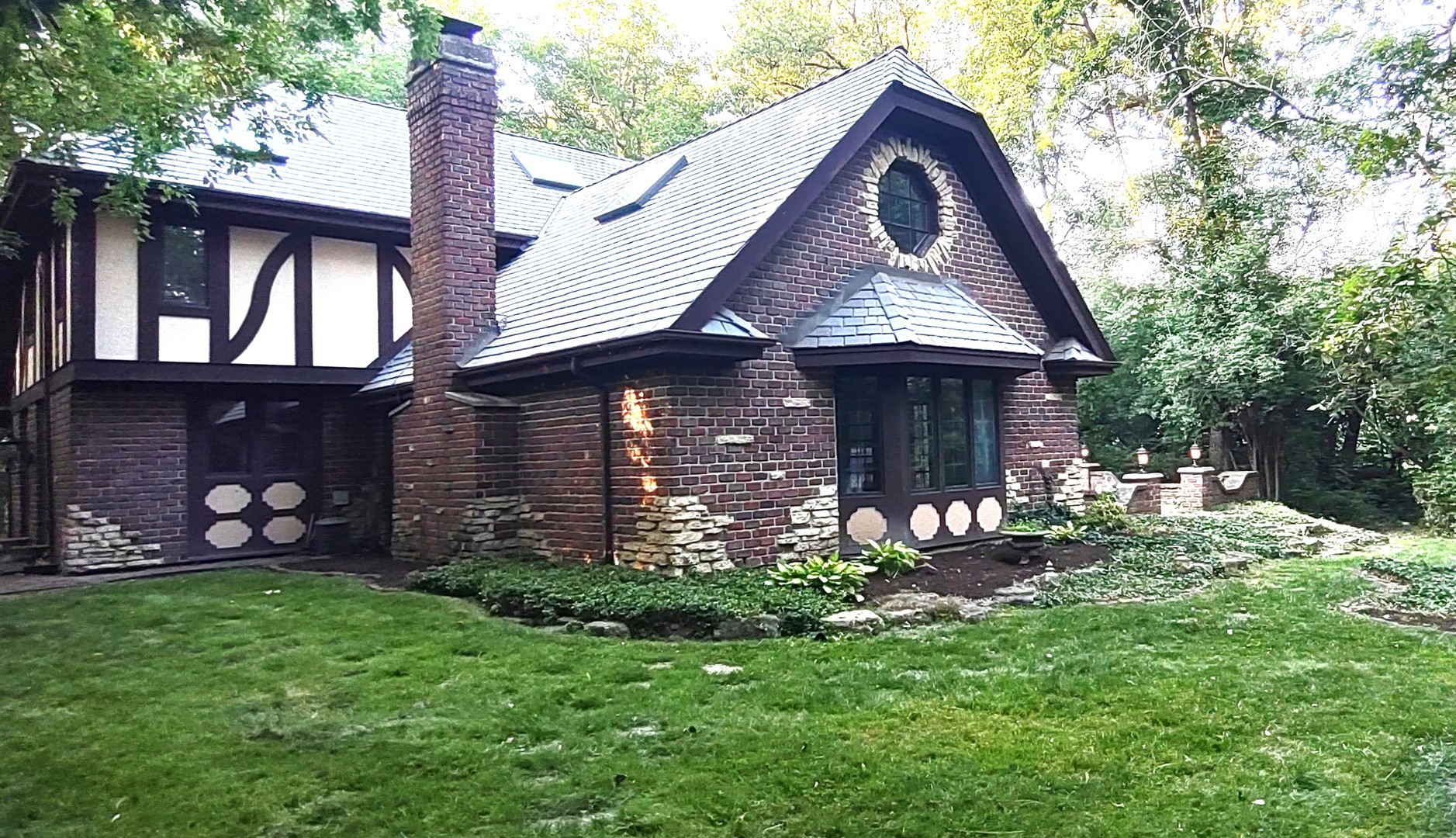 27W161 Mack Road Wheaton, IL 60189 - Photo 36 of 39 a front view of a house with garden