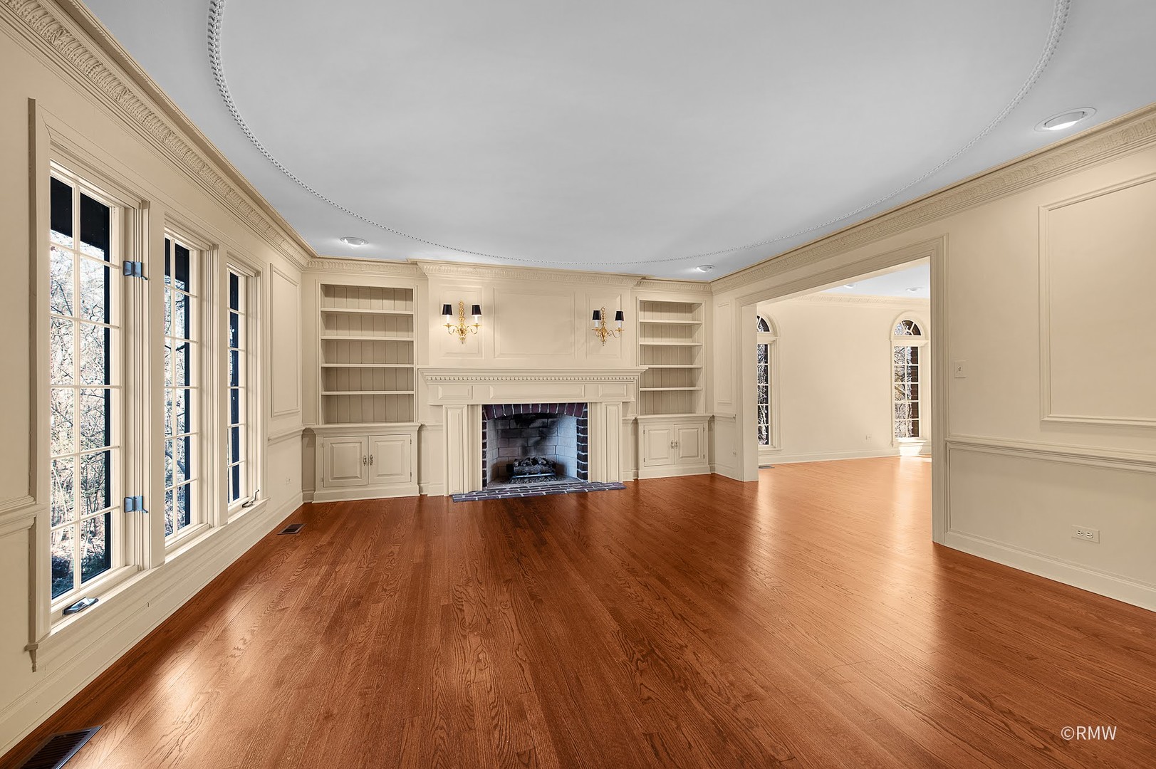 27W161 Mack Road Wheaton, IL 60189 - Photo 4 of 39 a view of an empty room with wooden floor fireplace and a window