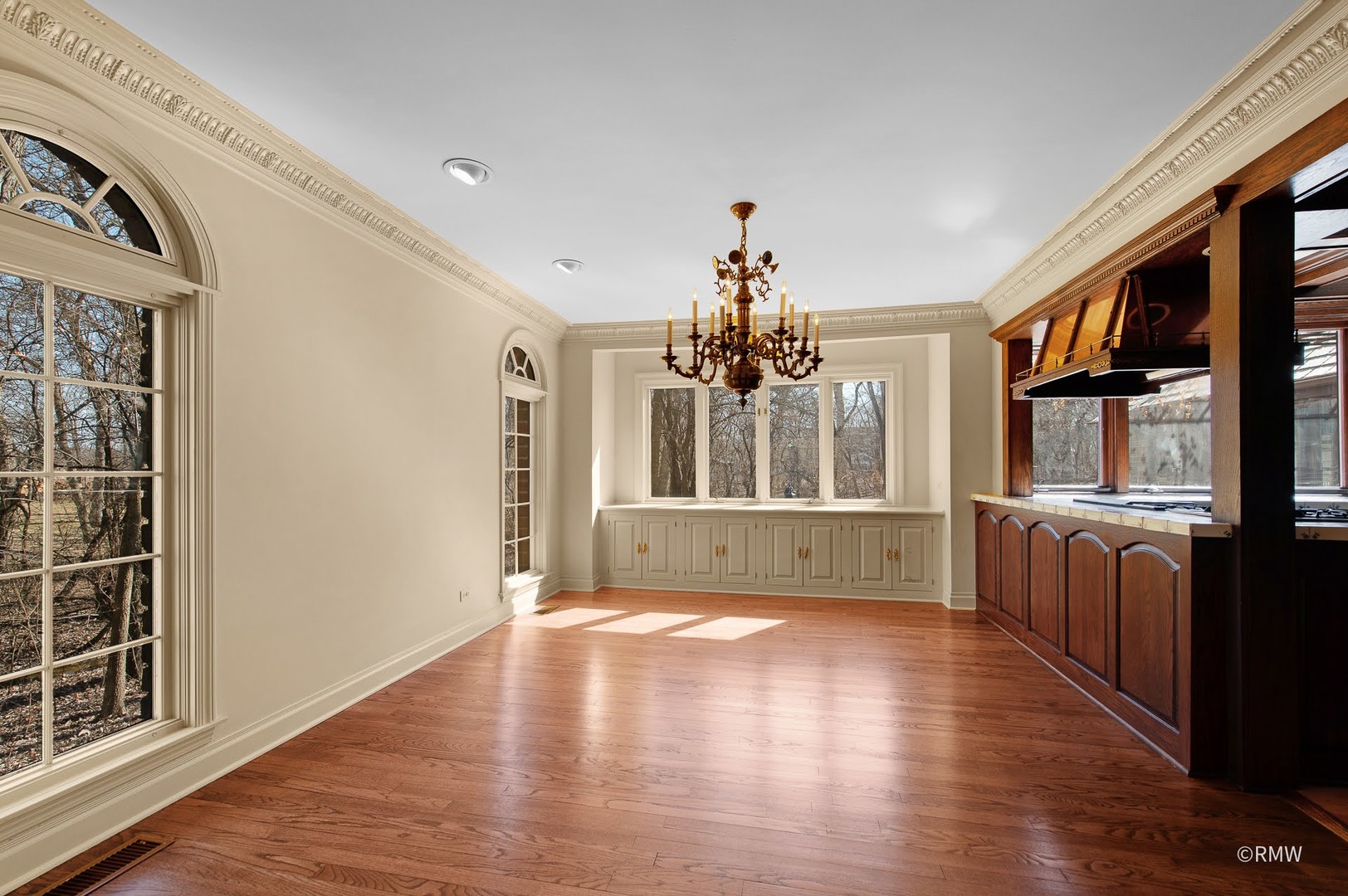 27W161 Mack Road Wheaton, IL 60189 - Photo 5 of 39 a view of a livingroom with wooden floor and windows