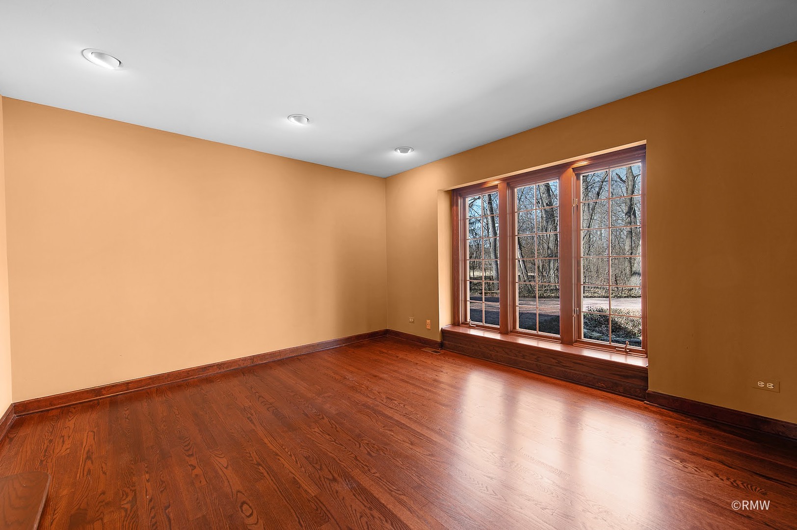 27W161 Mack Road Wheaton, IL 60189 - Photo 6 of 39 a view of an empty room with wooden floor and a window