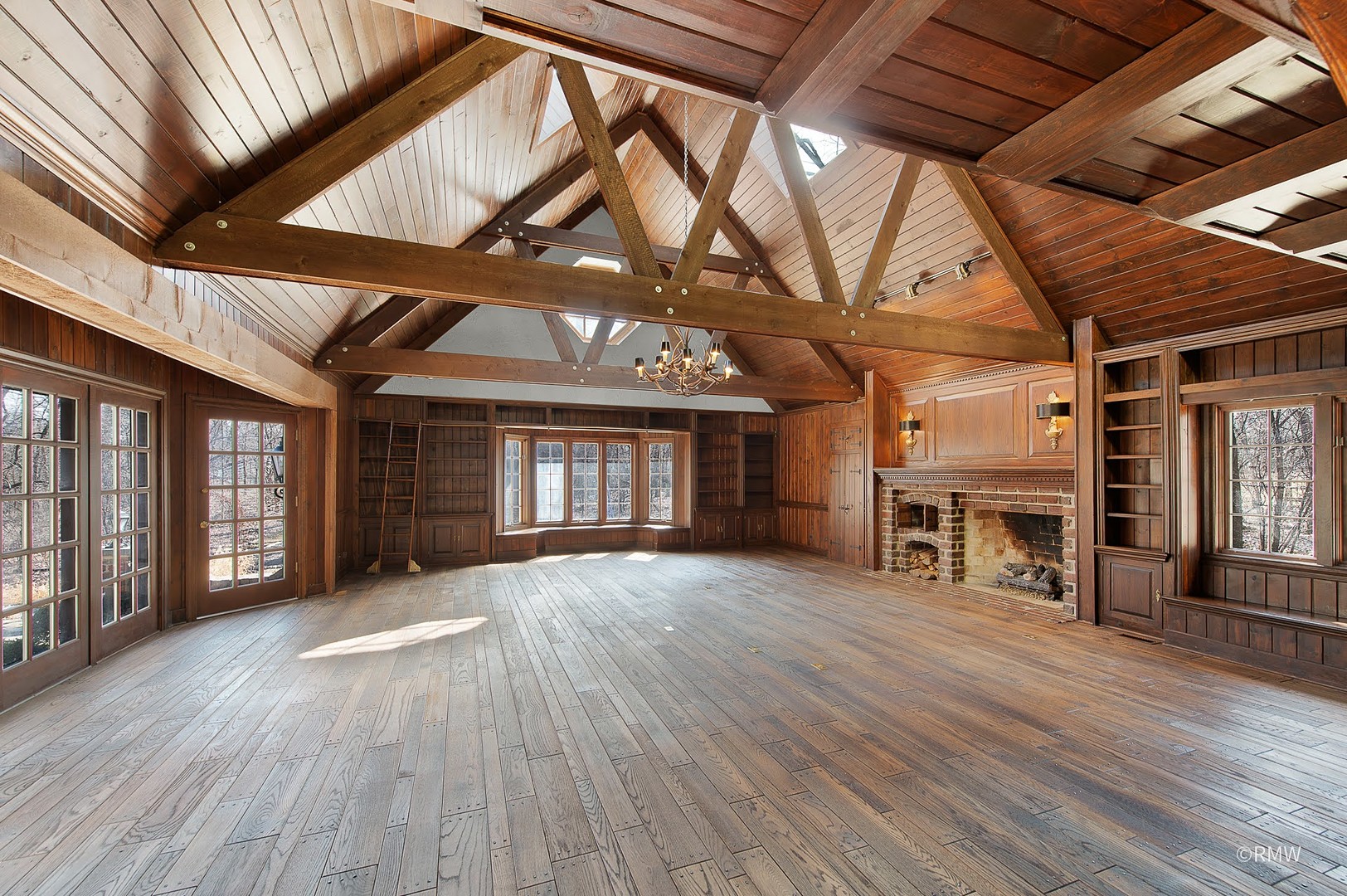 27W161 Mack Road Wheaton, IL 60189 - Photo 8 of 39 a view of an empty room with wooden floor and a window