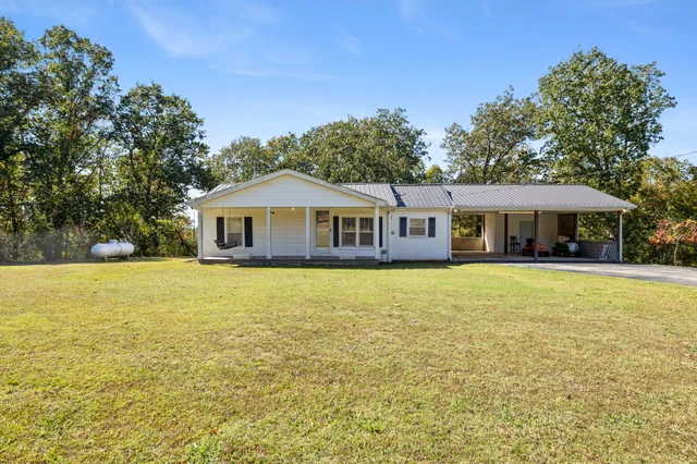 a front view of a house with swimming pool