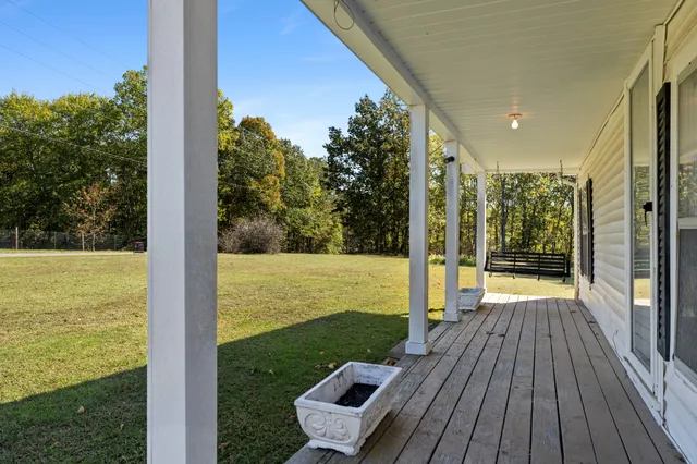 a view of a balcony with ocean view