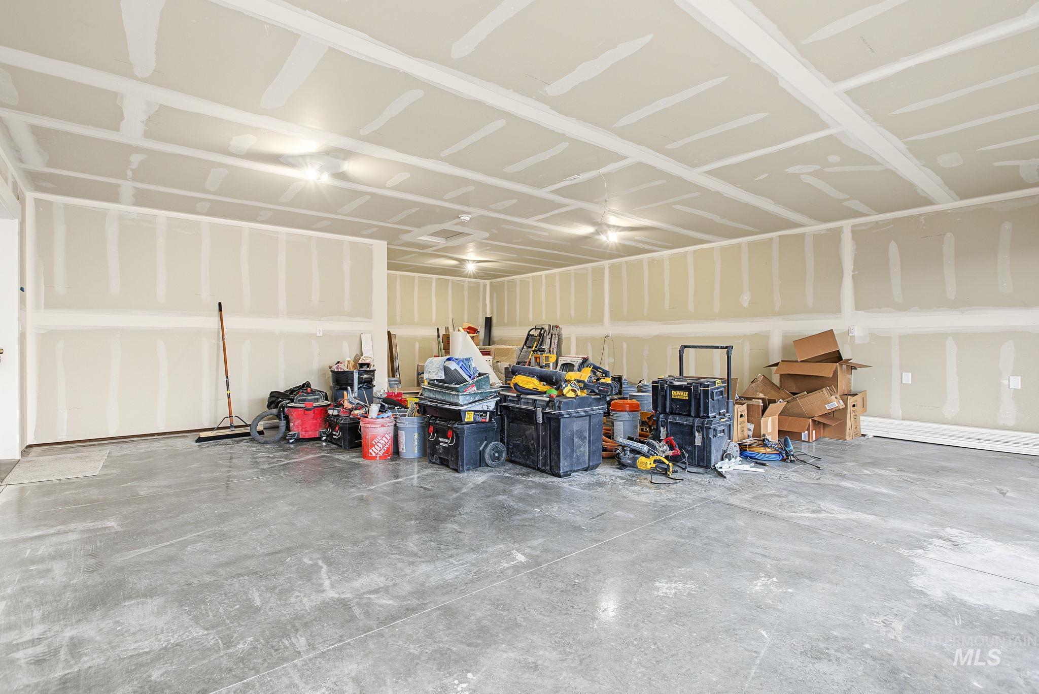 3217 Hidden Valley Loop Lewiston, ID 83501 - Photo 13 of 50 Vaulted ceiling with recessed lighting, black metal chandelier, wood-finish flooring, and expansive windows