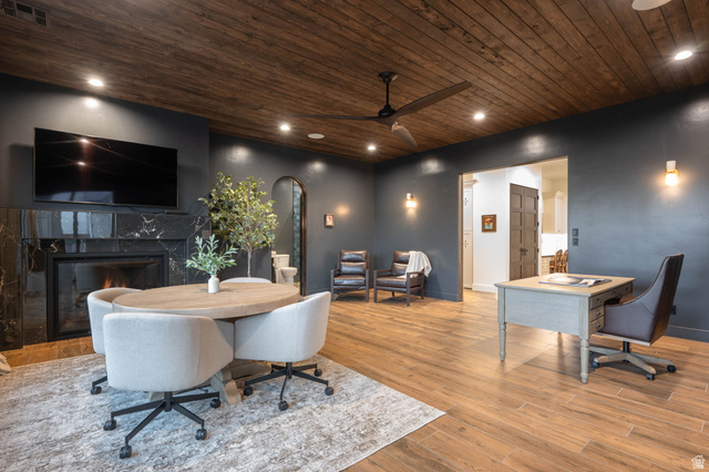 4871 South Homestead Way Washington, UT 84780 - Photo 57 of 151 Office space with arched walkways, wood ceiling, a premium fireplace, wood finished floors, and a ceiling fan