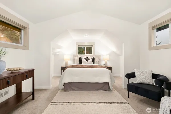 a bed room with a bed and a window