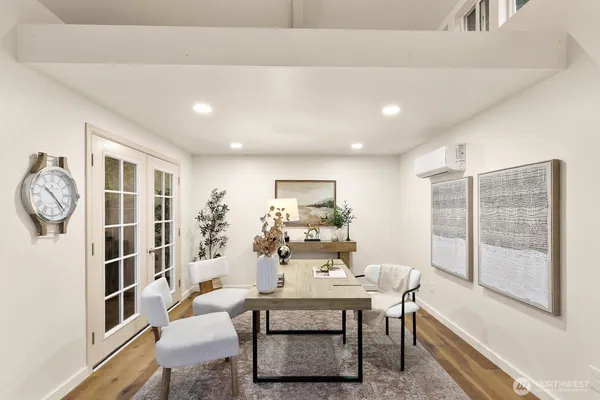 a view of a dining room with furniture window and wooden floor